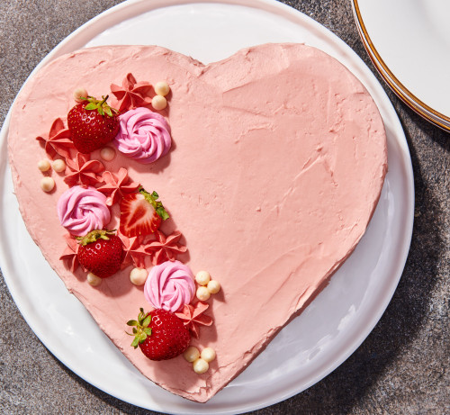 Pink heart cake with frosting flowers made in the Heart Cake Pan