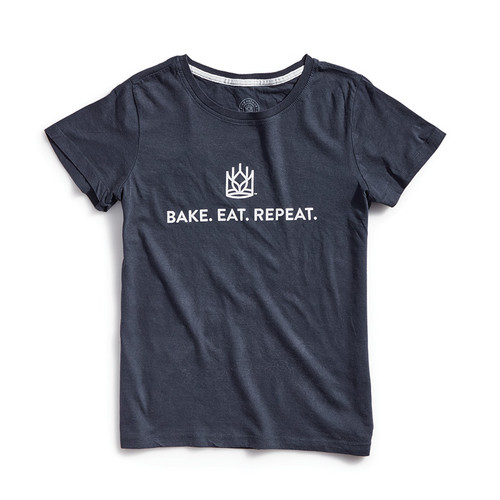 Front of navy blue tee. King Arthur Baking logo and bake, eat, repeat in white letters.