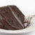 Slice of chocolate cake with frosting made with Gluten-Free Chocolate Cake Mix