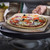 Pizza being cooked on Emile Henry Pizza Station
