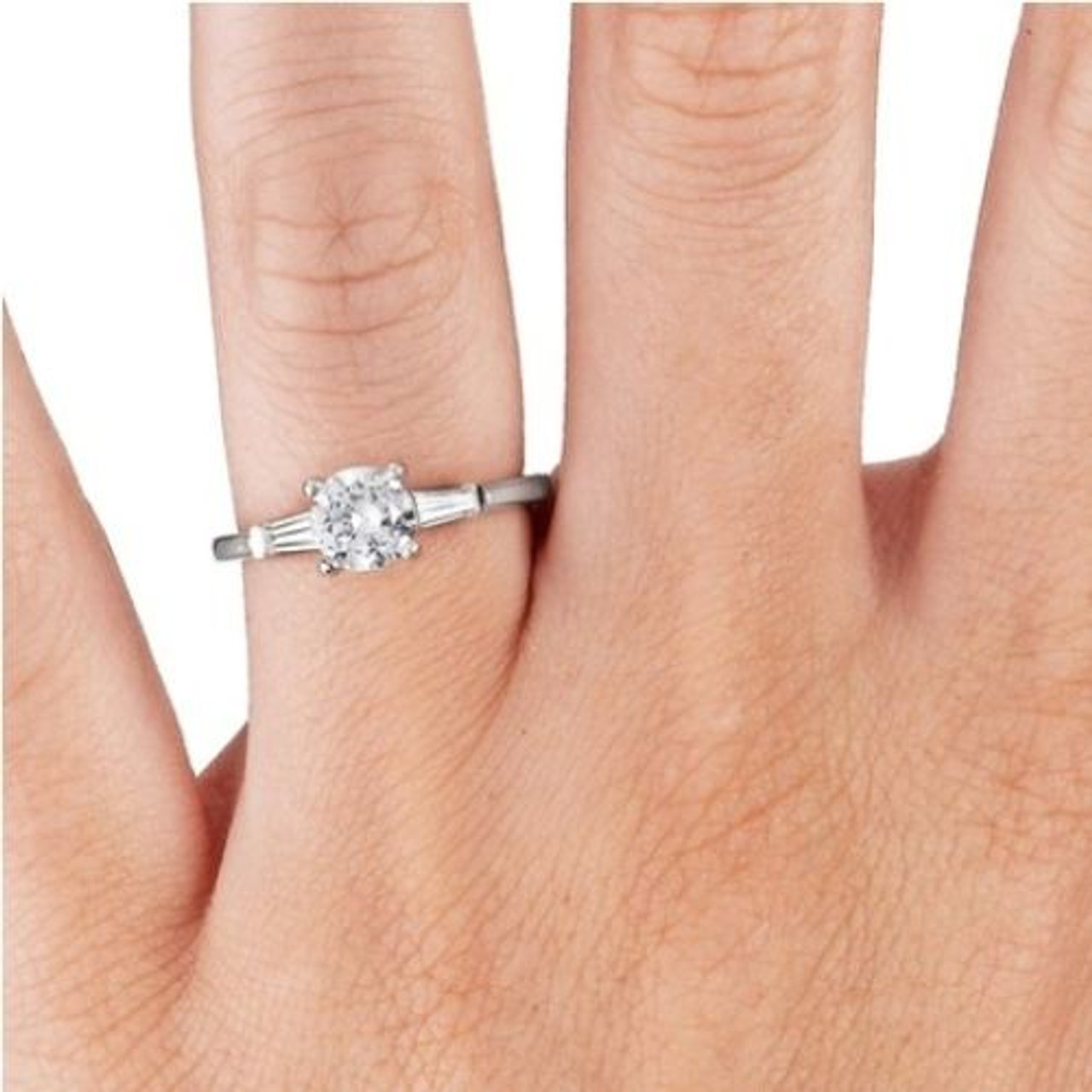 Round engagement store ring with baguettes