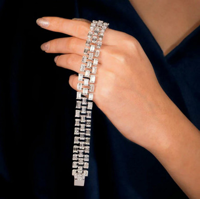 Brilliant Art Deco Bracelet Set With Baguette Diamonds In Three Rows.