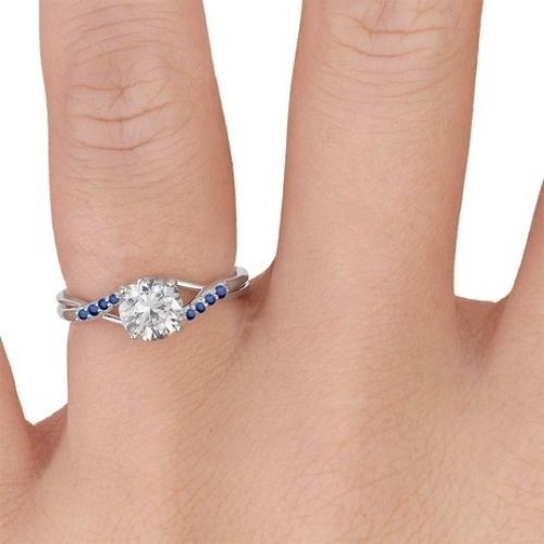 Delicate Tapered Pave Sapphire Engagement Ring with Center Diamond Finger View White Gold