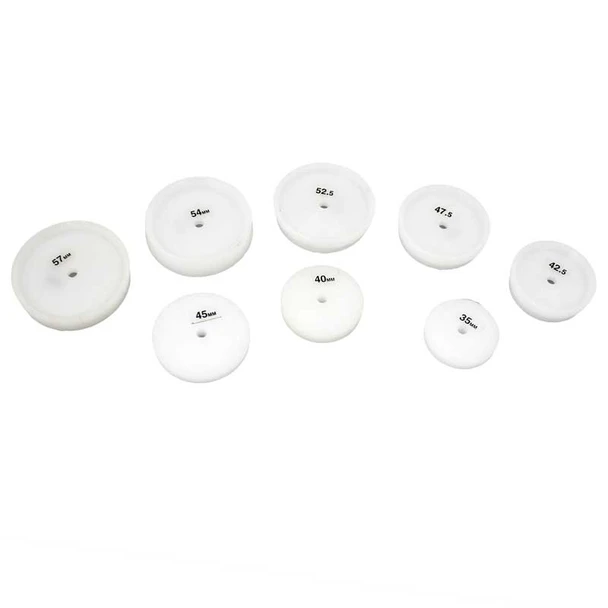 Set of eight large nylon dies for watch repair