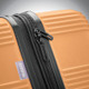 New - American Tourister NXT Checkered Hardside Carry On Spinner Suitcase - Orange
