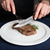 Steak Knife Lifestyle Cutting into Steak