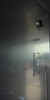 Stainless steel interior of an incubator showing an electrical outlet and access port.