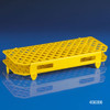 Yellow polypropylene 100-place snap-together microcentrifuge tube rack on blue surface.