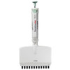 A white 12-channel adjustable volume pipette with a green plunger and tip, shown upright.