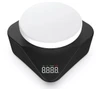 A black and white magnetic hotplate stirrer pod from a top-down angle, featuring a digital display on the front.