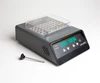 Labnet digital dry bath with dual block, clear plastic lid, green LED display, and metal probe on a white surface.