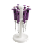 White and purple pipettors on a round carousel stand.