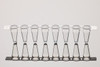 NEST 0.2 mL white PCR 8-strip tubes on a reflective surface, viewed from the front.
