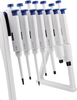 A set of white and blue single-channel adjustable pipettes displayed on a white stand.