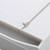 Close-up of gray plastic interlocking mechanism on a 4E's Tissue Cassette Storage Cabinet.