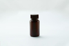 A brown plastic wide-mouth storage bottle with a ribbed screw cap on a white background.