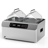 Stainless steel dual-chamber laboratory water bath with clear angled lids and digital control panel.
