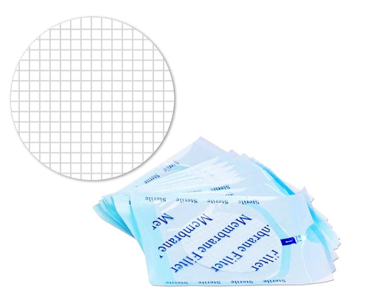 White gridded 47mm membrane filter shown next to a stack of sterile individual packages.