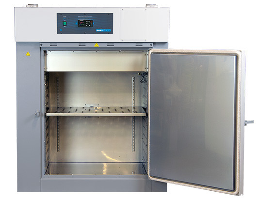 Front view of a gray Sheldon Manufacturing high-performance oven with its stainless steel door open.