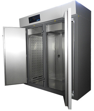 Sheldon Manufacturing high performance oven with stainless steel interior and double doors open.