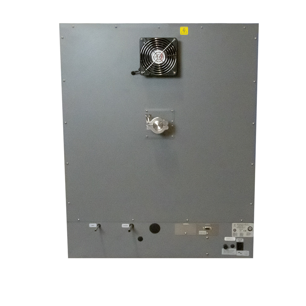 Gray metal back panel of Sheldon Manufacturing vacuum oven, featuring fan, KF-25 fitting, and ports.