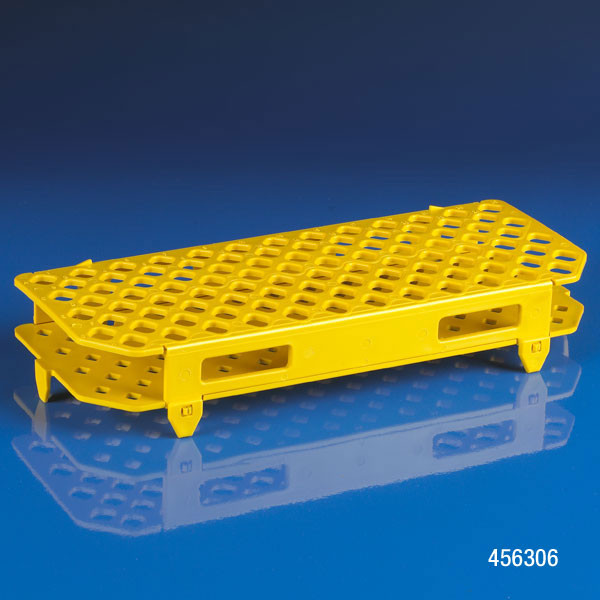 Yellow polypropylene 100-place snap-together microcentrifuge tube rack on blue surface.