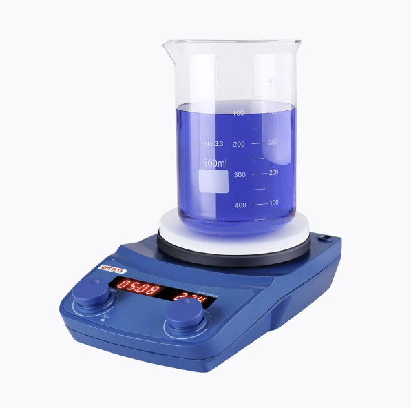 Blue and white magnetic stirrer with a clear glass beaker filled with blue liquid, featuring an LED display and control