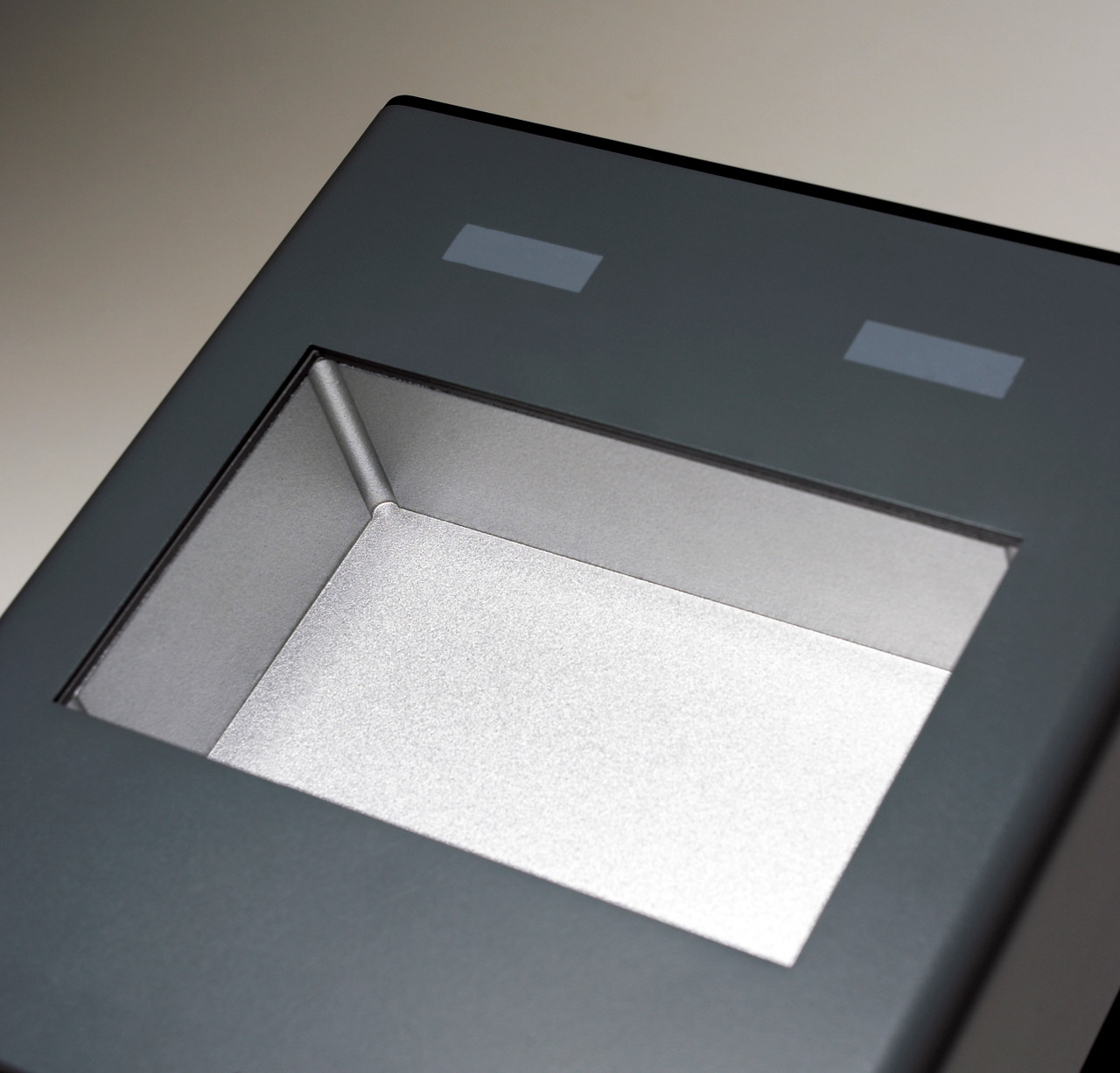 A close-up view of a dark gray, single block chamber for a Labnet digital dry bath.