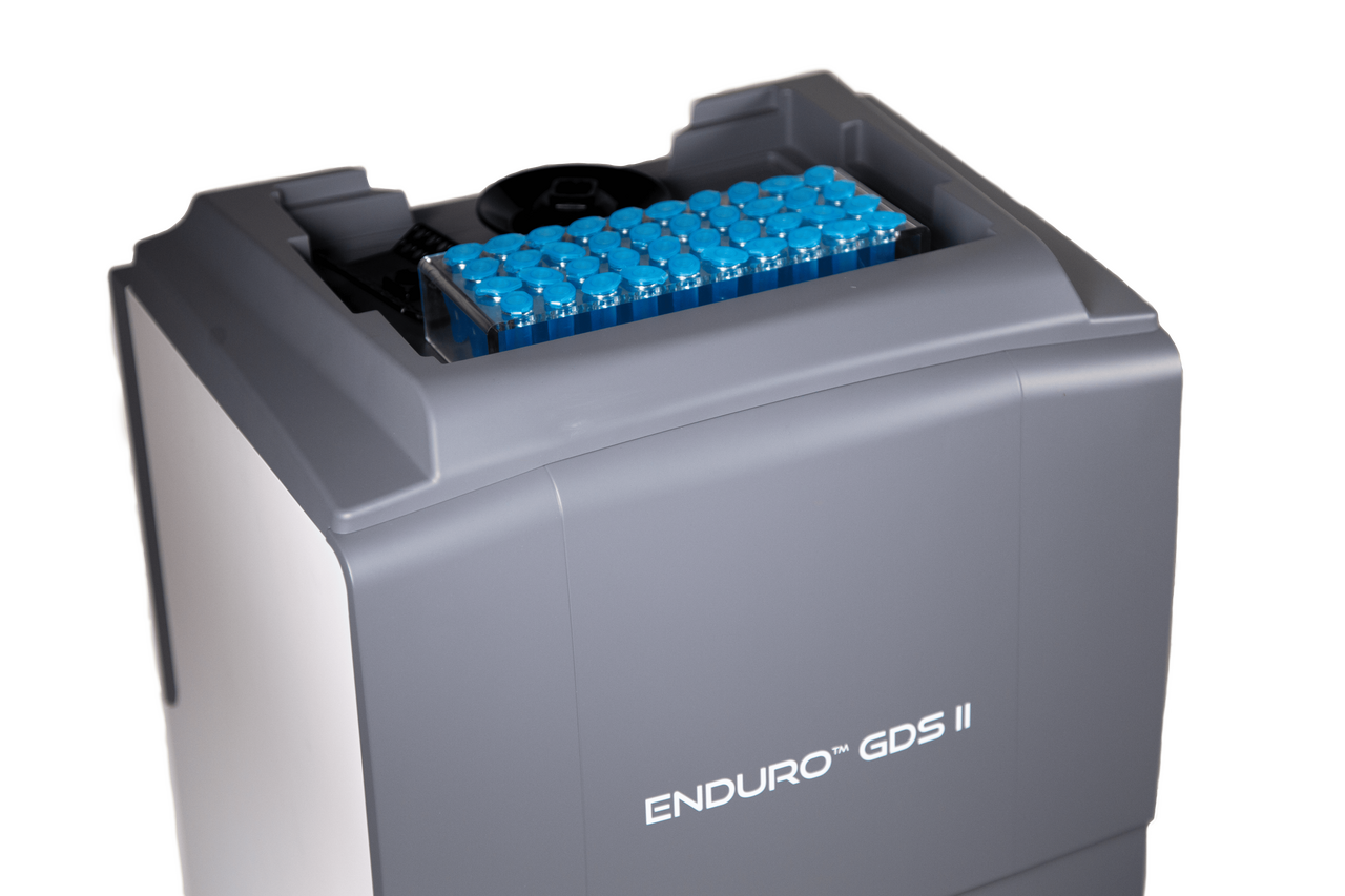 Angled view of the grey Labnet Enduro GDS II gel documentation system, with blue vials stored on top.