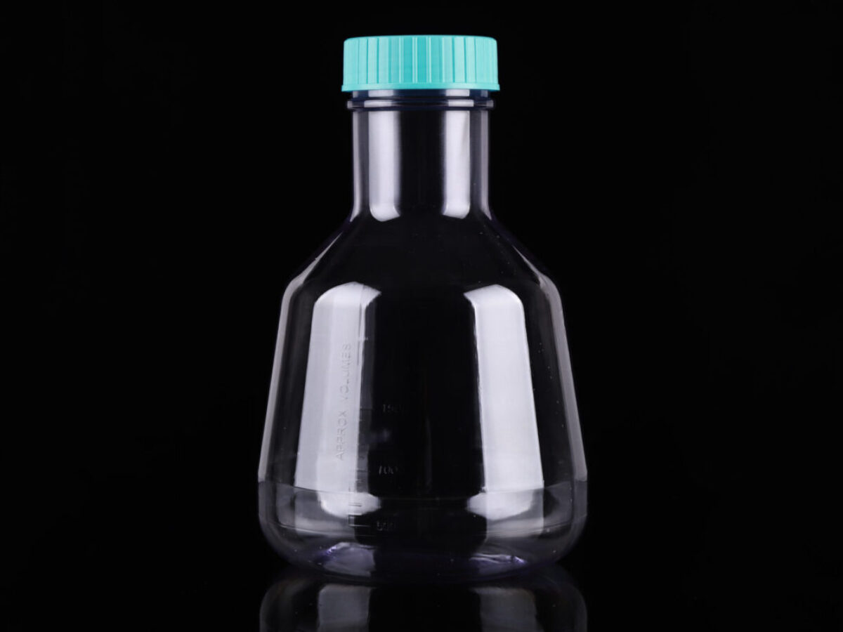 Clear plastic 3L Erlenmeyer flask with flat base and teal cap on a black surface.