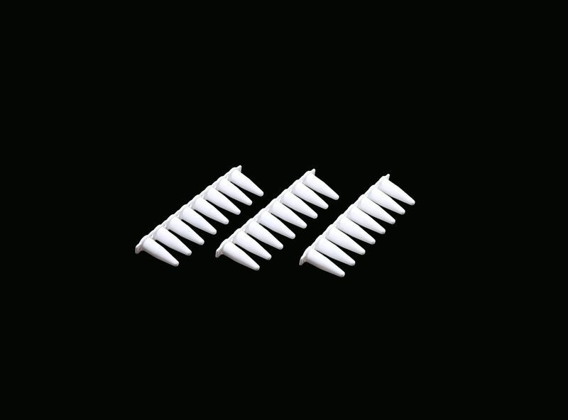 Three white 0.2 mL PCR 8-strip tubes arranged diagonally on a black background.