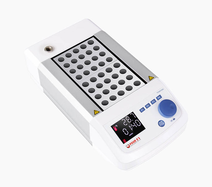 White and silver Four E's dry bath incubator with two blocks, digital display, and blue control knob on a white background.
