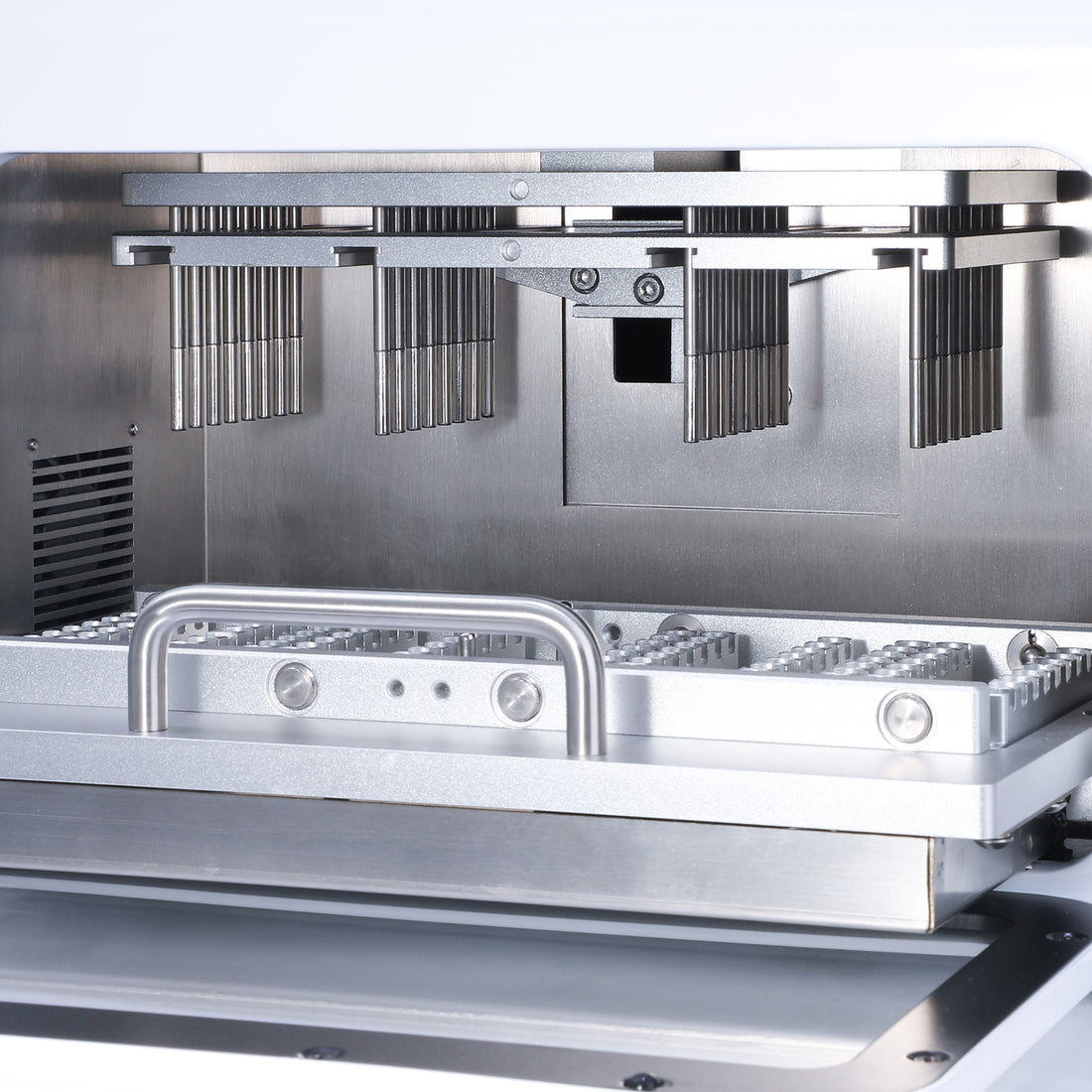 Interior view of 4E's MultiEX 032 nucleic acid extractor showing metal magnetic rod blocks and sample tray.
