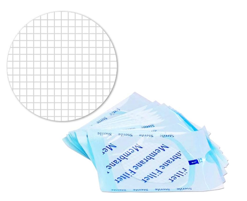 White gridded 47mm membrane filter shown next to a stack of sterile individual packages.