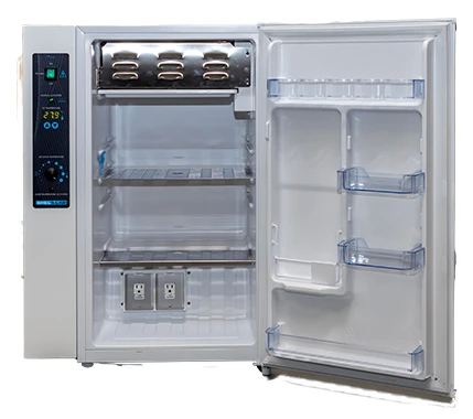 Sheldon Manufacturing refrigerated incubator with open door, showing interior shelves, controls, and two electrical outlets.