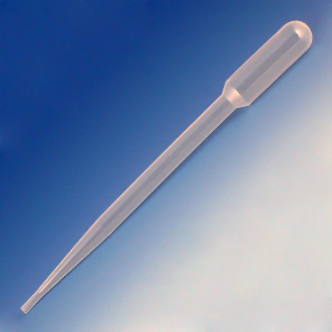 Clear plastic transfer pipet viewed at a diagonal angle against a blue-to-white gradient background.