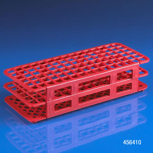 Red plastic 60-place snap-together test tube rack angled on a blue surface.