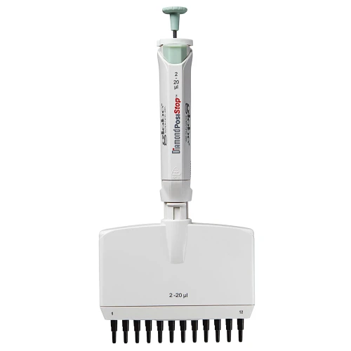 White and green 12-channel adjustable volume pipette with black tips on a white background.