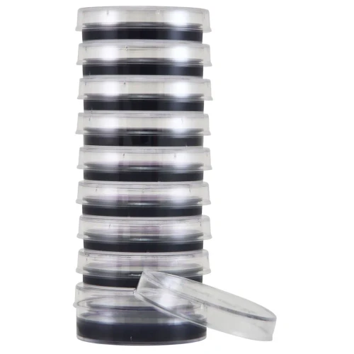 A vertical stack of ten clear plastic Petri dishes containing dark media, with one empty lid leaning against the base.
