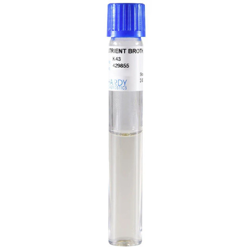 A vertical glass test tube with a blue screw cap, containing clear liquid growth medium and a label reading "Nutrient Broth".