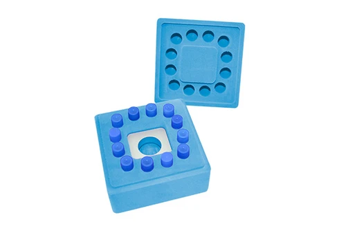 Blue NEST Ice Free Cool Box with 12-tube base and lid, showing internal alloy and foam layers from an elevated view.