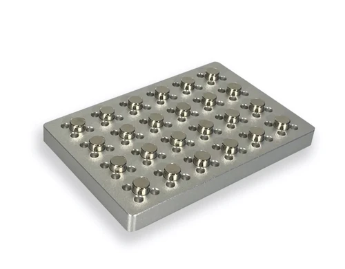 Anodized aluminum 4E's magnetic bead separation rack viewed from an elevated angle, showing rows of cylindrical magnets.