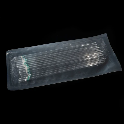 A bulk pack of clear polystyrene serological pipettes with green rings inside a sealed plastic bag.