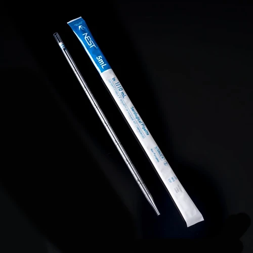A 5mL NEST serological pipette beside its white and blue plastic-plastic wrapper.