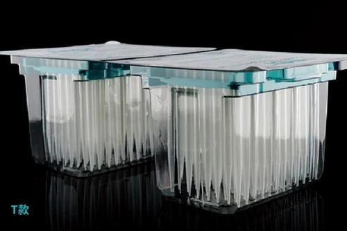 Two blister packs of clear 200ul robotic pipette tips against a black background.