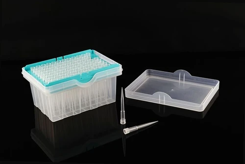 Clear plastic robotic pipet tips in a 96-well rack with teal frame and a detached lid.