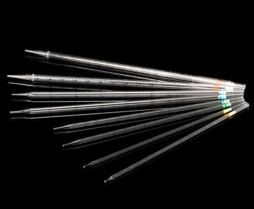 Clear plastic serological pipettes of various sizes with color-coded bands fanned out on black.