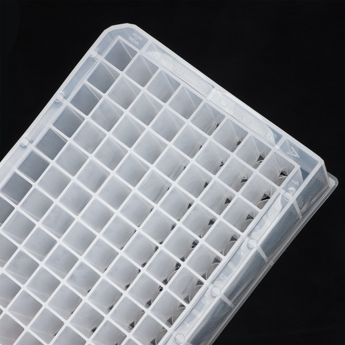 Transparent 96 deepwell plate with V-bottom wells, viewed from an angled top perspective.
