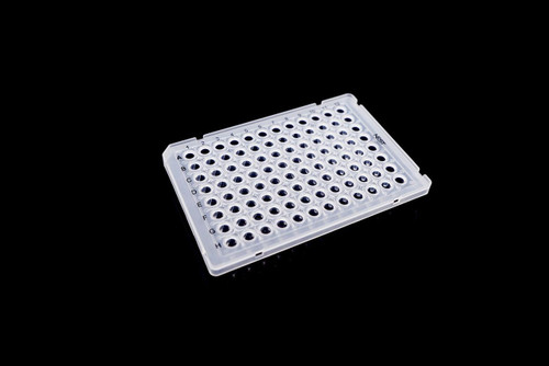 Clear semi-skirted 96-well PCR plate at an angle on a black background, with visible well lettering and numbering.