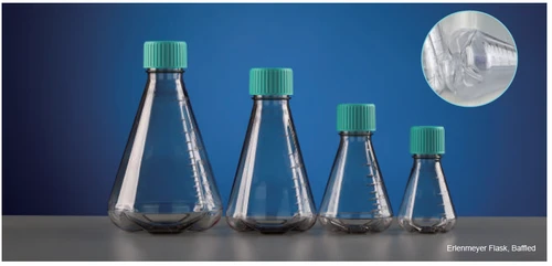 Four clear plastic Erlenmeyer flasks with teal screw caps and volume graduations, set against a blue background, with an